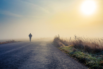 Man on a road alone. Image depicting the isolation of depression